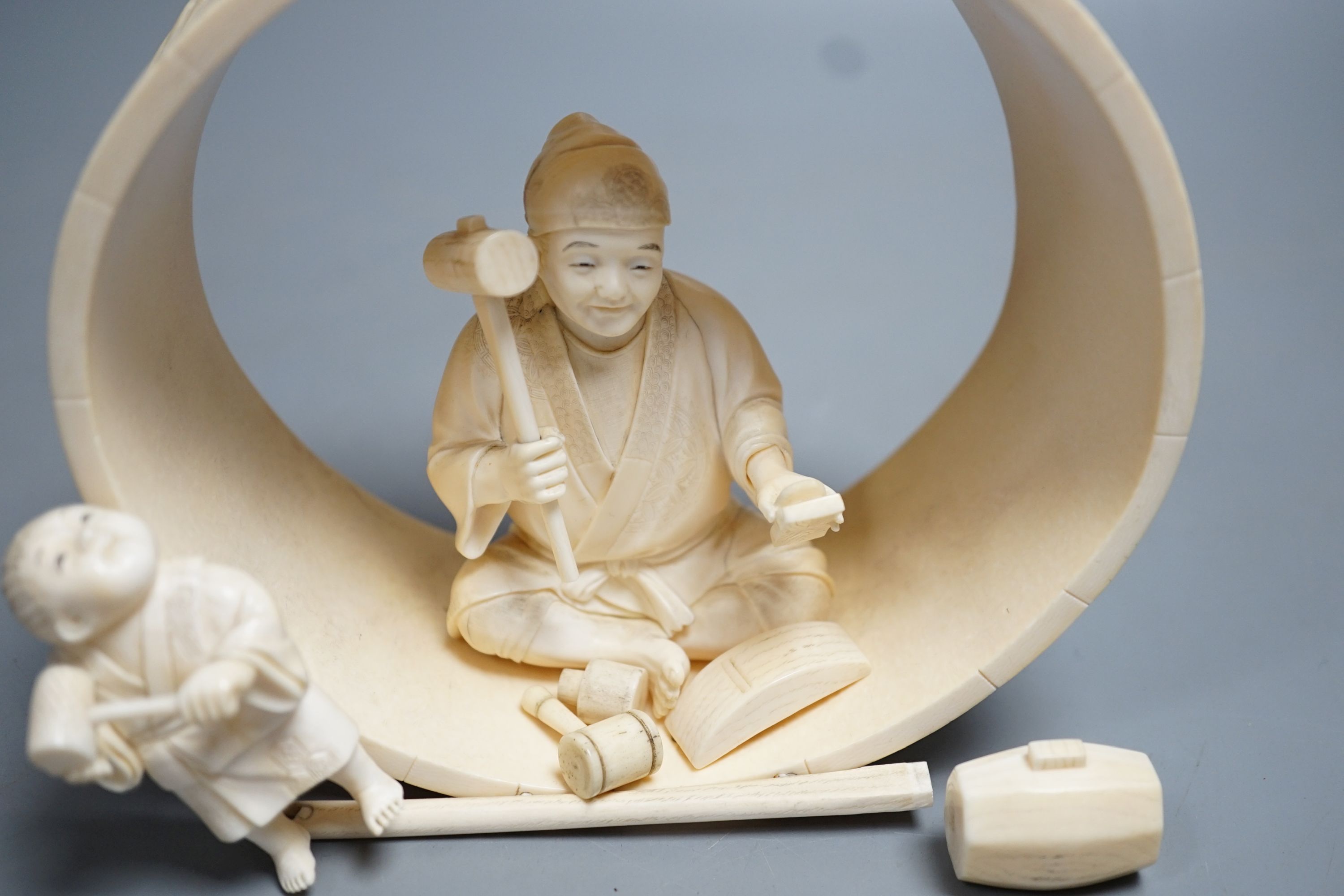 A Japanese ivory okimono of carpenter and child, Meiji period 15cm